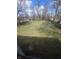 Expansive backyard enclosed by a wooden fence and plenty of green space at 930 Charlene Ln, Anderson, IN 46011