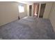Bedroom with large window with two closets, neutral-toned walls at 930 Charlene Ln, Anderson, IN 46011
