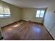Spacious bedroom features hardwood floors, two windows, and ample natural light at 930 Charlene Ln, Anderson, IN 46011