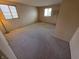 Unfurnished bedroom featuring two windows and neutral colored walls at 930 Charlene Ln, Anderson, IN 46011