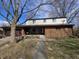 Charming home with a mix of brick and siding, front porch, and two-car garage at 930 Charlene Ln, Anderson, IN 46011
