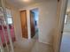 Hallway with several doorways and a built-in storage cabinet at 930 Charlene Ln, Anderson, IN 46011