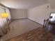 Bright living room with carpet flooring, large window, and open layout at 930 Charlene Ln, Anderson, IN 46011