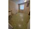 Unfurnished room with green flooring and a window providing natural light at 930 Charlene Ln, Anderson, IN 46011