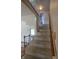 Carpeted staircase with white banister leading to the upper level at 930 Charlene Ln, Anderson, IN 46011