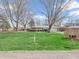 Charming single-story brick home with an attached garage and a well-manicured front lawn at 9406 Northeastern Ave, Indianapolis, IN 46239