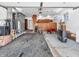 Bright garage with utility equipment, storage, and classic garage door at 9406 Northeastern Ave, Indianapolis, IN 46239