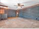 Bright and airy living room with carpet and access to other areas of the home at 9406 Northeastern Ave, Indianapolis, IN 46239