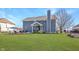 The backyard features a patio with lounge furniture, and a meticulously maintained lawn at 1043 Palomar Dr, Westfield, IN 46074