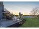 Outdoor patio featuring a bar and grill with table settings and a view of the pond at 1043 Palomar Dr, Westfield, IN 46074