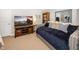 Cozy basement bedroom featuring a large television, bookcase, and a comfortable seating area at 1043 Palomar Dr, Westfield, IN 46074