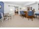 Basement recreation area featuring a bar, dining area, a sliding barn door, and a neutral color scheme at 1043 Palomar Dr, Westfield, IN 46074