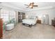 Large bedroom with a sitting area, soft carpet, and plenty of natural light at 1043 Palomar Dr, Westfield, IN 46074