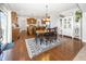 Open-concept dining area featuring hardwood floors and views of the kitchen at 1043 Palomar Dr, Westfield, IN 46074