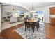 Cozy dining room open to living room with a view of the fireplace and backyard at 1043 Palomar Dr, Westfield, IN 46074