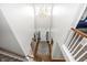 View from the stairs to the foyer with a chandelier and a hardwood floor entryway at 1043 Palomar Dr, Westfield, IN 46074
