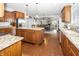 Open concept kitchen with wooden cabinets, granite countertops, and stainless steel appliances at 1043 Palomar Dr, Westfield, IN 46074