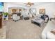 Open-concept living room with a view of the kitchen, dining area, and staircase at 1043 Palomar Dr, Westfield, IN 46074