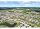 Expansive aerial view shows neighborhood layout and surrounding farmland at 10522 Hunters Crossing Blvd, Indianapolis, IN 46239