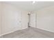 The bedroom features soft carpeting, a ceiling light, neutral paint, and two doors, offering comfort and functionality at 10522 Hunters Crossing Blvd, Indianapolis, IN 46239