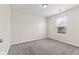 Bright bedroom with a window providing natural light and soft carpeting, creating a comfortable and inviting space at 10522 Hunters Crossing Blvd, Indianapolis, IN 46239