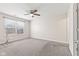 This bedroom features natural light, a ceiling fan and neutral carpet at 10522 Hunters Crossing Blvd, Indianapolis, IN 46239