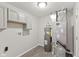 Organized utility room featuring updated water heater, furnace, and plenty of storage at 10522 Hunters Crossing Blvd, Indianapolis, IN 46239