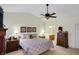 Tranquil bedroom with vaulted ceilings, soft lighting, and a glimpse into an en-suite bathroom at 10629 Medinah Dr # 1, Indianapolis, IN 46234