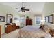 A spacious bedroom with a mirror, soft lighting, and coordinated decor for relaxation at 10629 Medinah Dr # 1, Indianapolis, IN 46234