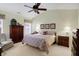 A serene bedroom with soft lighting, a ceiling fan, and coordinated decor for relaxation at 10629 Medinah Dr # 1, Indianapolis, IN 46234