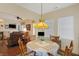 Charming dining area with a pendant light fixture and an open view of the living area at 10629 Medinah Dr # 1, Indianapolis, IN 46234