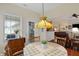 Bright dining area features a pendant light, backyard access and an open view of the living area at 10629 Medinah Dr # 1, Indianapolis, IN 46234