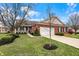 Charming brick home with a well-manicured lawn and a two car garage, perfect for suburban living at 10629 Medinah Dr # 1, Indianapolis, IN 46234