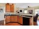 This kitchen is equipped with stainless steel appliances, granite countertops and hardwood floors at 10629 Medinah Dr # 1, Indianapolis, IN 46234