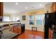A kitchen with rich wood floors, granite countertops, and modern appliances, great for cooking at 10629 Medinah Dr # 1, Indianapolis, IN 46234