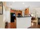 Eat-in kitchen features cherry cabinets and a breakfast bar that opens to the living area at 10629 Medinah Dr # 1, Indianapolis, IN 46234