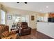Relaxing living room features a view to the breakfast nook and kitchen at 10629 Medinah Dr # 1, Indianapolis, IN 46234