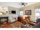 Comfortable living room featuring a fireplace, mounted TV, and a mix of furniture styles at 10629 Medinah Dr # 1, Indianapolis, IN 46234