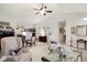 Spacious living room with two large chairs, neutral walls, and a ceiling fan at 10629 Medinah Dr # 1, Indianapolis, IN 46234