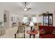 Comfortable living room with vaulted ceilings, neutral carpet, and large glass curio cabinet at 10629 Medinah Dr # 1, Indianapolis, IN 46234