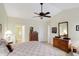 Bedroom with vaulted ceiling, complemented by traditional furnishings and an ensuite bathroom at 10629 Medinah Dr # 1, Indianapolis, IN 46234