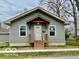 Charming home featuring a covered entryway and a well-maintained lawn at 1100 Graham St, Franklin, IN 46131