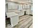 Modern kitchen with gray cabinets, subway tile backsplash, and breakfast bar at 1100 Graham St, Franklin, IN 46131