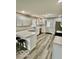 Bright kitchen featuring gray cabinets, subway tile backsplash, and breakfast bar at 1100 Graham St, Franklin, IN 46131