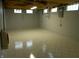 Finished basement featuring a tile floor, painted block walls and multiple windows at 1106 N Hartman Dr, Indianapolis, IN 46219