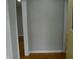 View of the entryway with a yellow door and wooden floors at 1106 N Hartman Dr, Indianapolis, IN 46219
