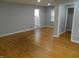 Bright and airy living room featuring hardwood floors and seamless transitions to other spaces at 1106 N Hartman Dr, Indianapolis, IN 46219
