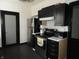 Well-equipped kitchen featuring dark cabinets and stainless steel appliances at 1153 W 29Th St, Indianapolis, IN 46208