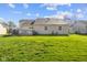 Expansive backyard featuring a well-maintained lawn and a wood deck, perfect for outdoor entertaining and relaxation at 1160 Ida Ct, Greenwood, IN 46143