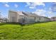 Expansive backyard featuring a well-maintained lawn and a wood deck, perfect for outdoor entertaining and relaxation at 1160 Ida Ct, Greenwood, IN 46143